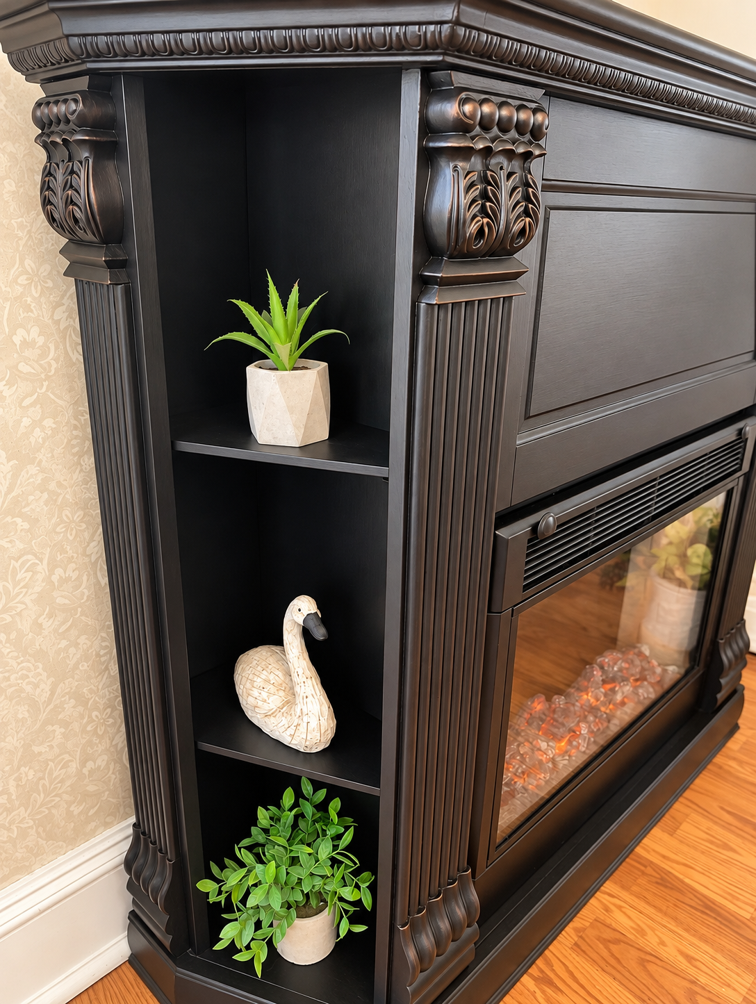 Side view showing the built-in display shelves on a black electric fireplace