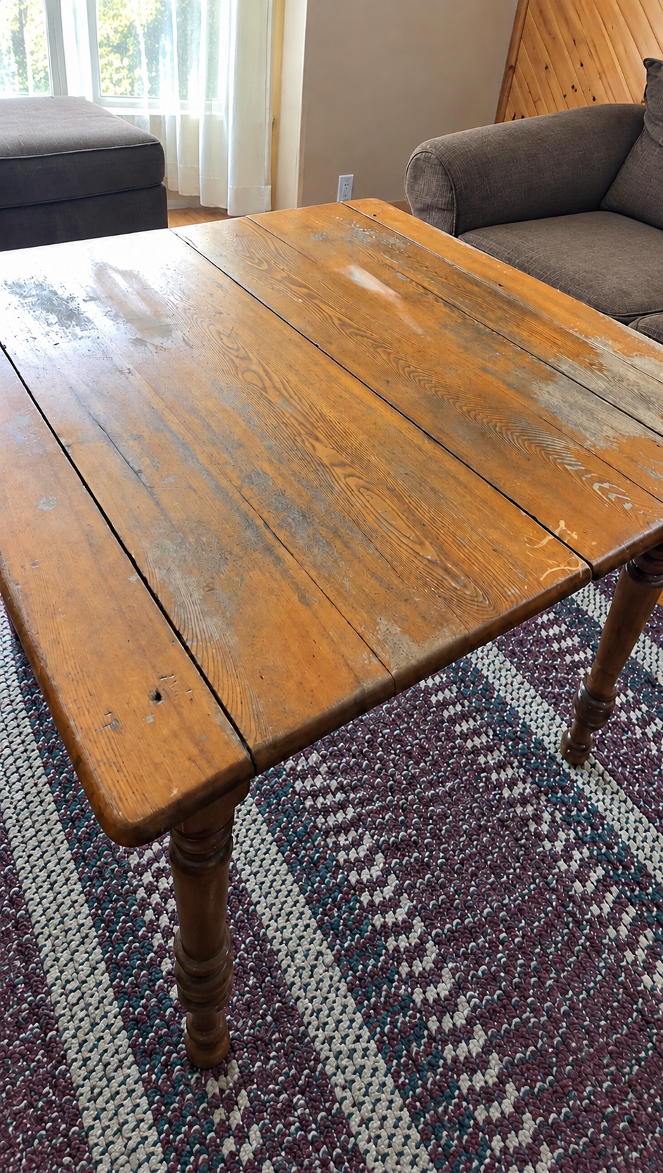 Worn rectangular farmhouse dining table before refinishing