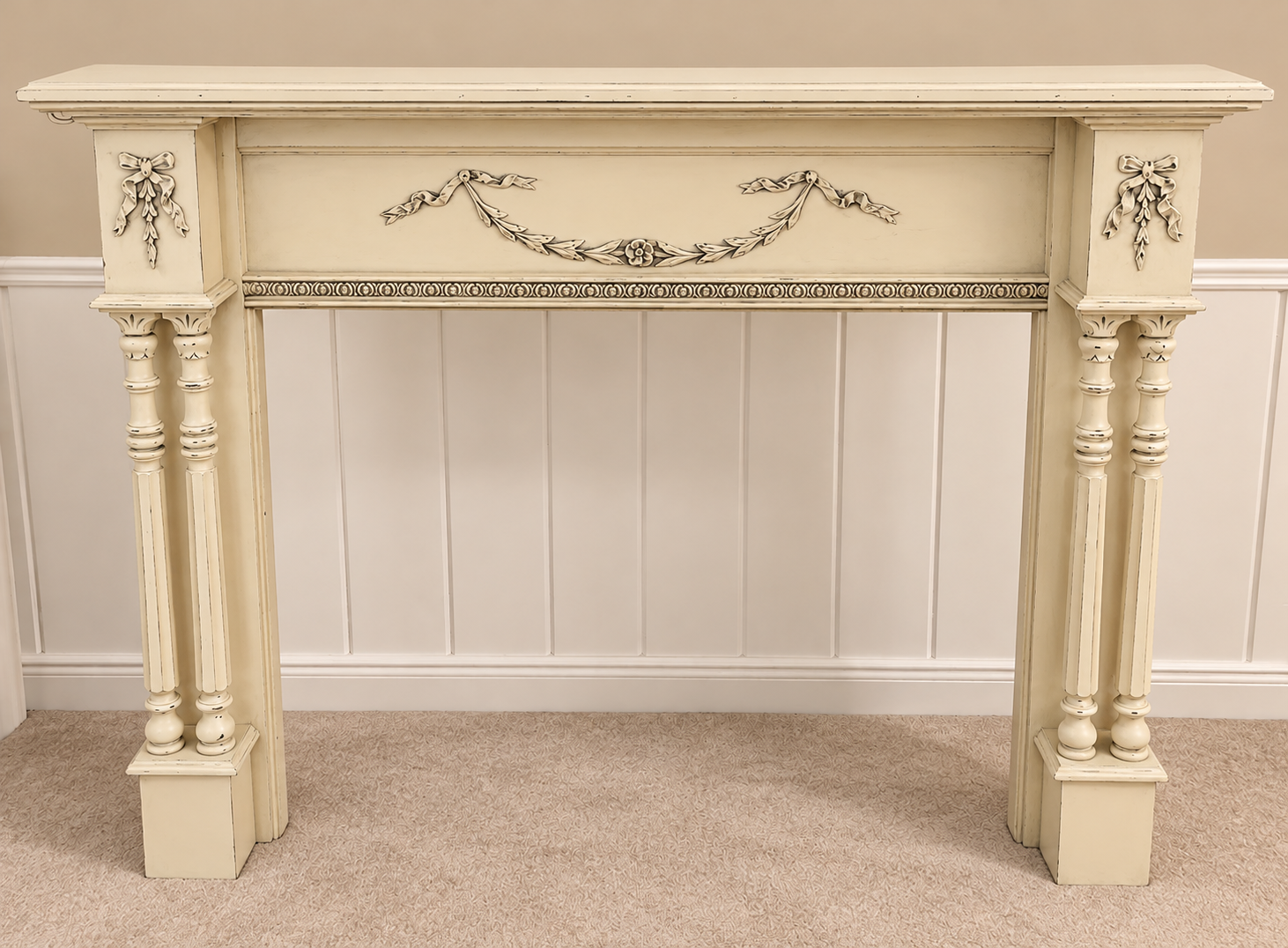 Same ornate fireplace mantel refinished in a soft cream finish