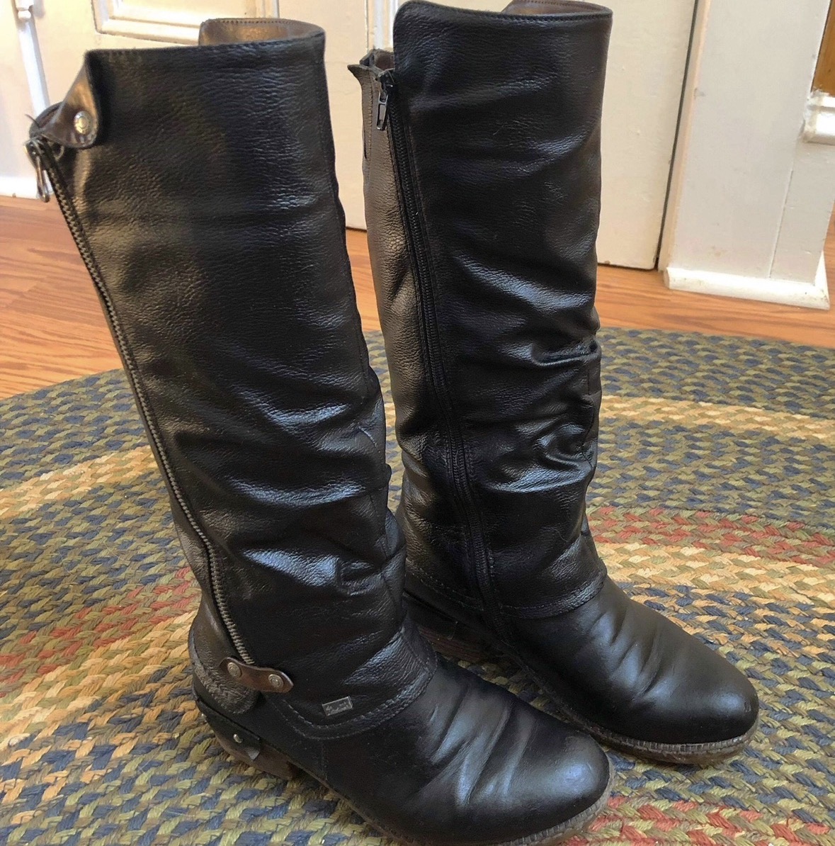 Same tall black leather boots after restoration