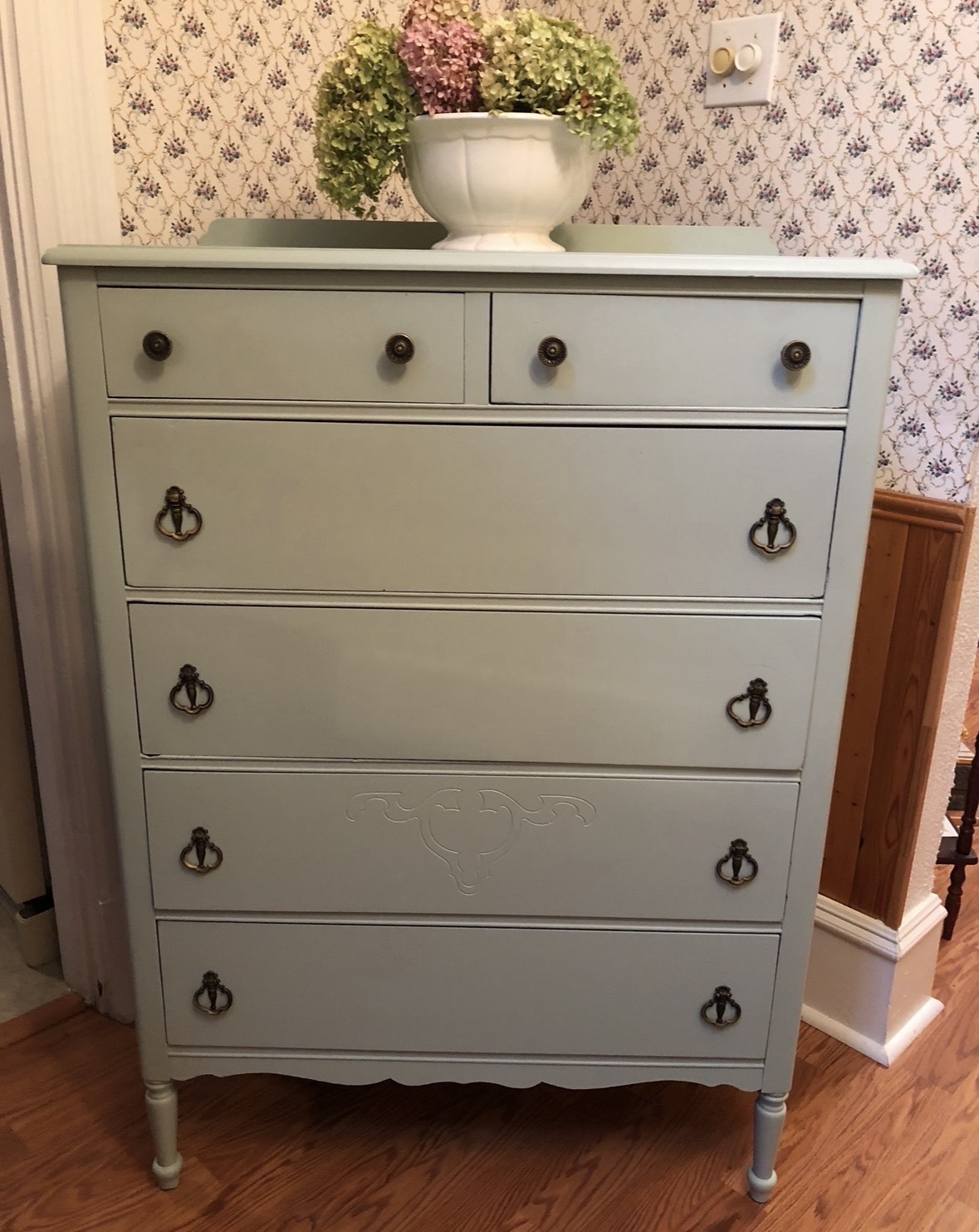 Tall dresser refinished in a soft pale green with antique hardware